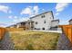 A wooden fenced in backyard with a patio and newly installed sod at 14696 Bonsmara Dr, Mead, CO 80542
