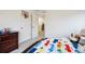 Cheerful ' bedroom with playful decor, closet, and light-filled interiors at 14696 Bonsmara Dr, Mead, CO 80542
