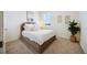 Serene bedroom featuring a plush bed, neutral decor, and a bright window at 14696 Bonsmara Dr, Mead, CO 80542