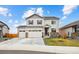Charming two-story home featuring a three-car garage, stone accents, and a well-maintained front yard at 14696 Bonsmara Dr, Mead, CO 80542