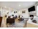 Inviting living room with a fireplace, comfortable seating, and a cozy area rug at 14696 Bonsmara Dr, Mead, CO 80542