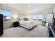Bright and spacious main bedroom features large windows and a comfortable layout at 14696 Bonsmara Dr, Mead, CO 80542