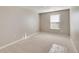 Inviting bedroom with a window, neutral walls, and soft carpeting, creating a cozy atmosphere at 18358 Field Mint Pt, Parker, CO 80134