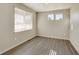 Inviting bedroom featuring gray vinyl flooring, lots of natural light, and neutral paint at 18358 Field Mint Pt, Parker, CO 80134