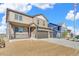 Charming two-story home with a spacious three-car garage, a welcoming front porch, and professionally landscaped yard at 18358 Field Mint Pt, Parker, CO 80134