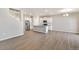 Modern kitchen with stainless steel appliances, gray countertops, white cabinetry and vinyl flooring at 18358 Field Mint Pt, Parker, CO 80134