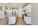 Bright kitchen featuring white cabinets and stainless steel appliances at 18358 Field Mint Pt, Parker, CO 80134