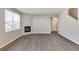 Bright living room with fireplace and vinyl flooring, filled with natural light from a large window at 18358 Field Mint Pt, Parker, CO 80134