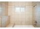 Bathroom with tiled shower and tub at 1264 Uinta St, Denver, CO 80220