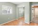 Bedroom featuring mirrored closet doors, and wood floor at 1264 Uinta St, Denver, CO 80220
