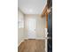 The entryway features wood look floors, a white door, and an accent beam at 1264 Uinta St, Denver, CO 80220