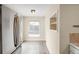Galley kitchen with stainless steel appliances and a window for natural light at 1264 Uinta St, Denver, CO 80220