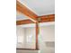 Living room with exposed beam and view into another room at 1264 Uinta St, Denver, CO 80220