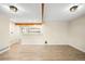 Spacious living room with beautiful wood-look floors and exposed beams at 1264 Uinta St, Denver, CO 80220