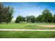 Scenic view of a well-maintained park with lush greenery and recreational facilities at 1264 Uinta St, Denver, CO 80220