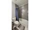 Bathroom with gray subway tiles, bathtub and shower combination at 1295 Utica St, Denver, CO 80204