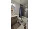 Bathroom featuring a shower/bathtub combination with gray subway tiles and a modern vanity at 1295 Utica St, Denver, CO 80204