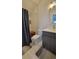 Well-lit bathroom featuring a tiled shower, modern toilet, and sleek vanity at 1295 Utica St, Denver, CO 80204