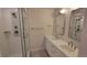 Modern bathroom with double sinks, sleek countertops, and walk-in shower at 1295 Utica St, Denver, CO 80204