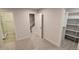 Bright bedroom featuring an attached bathroom with glass shower and access to stairs at 1295 Utica St, Denver, CO 80204