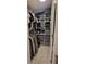 Organized walk-in closet with shelving, hanging racks, and ample storage space at 1295 Utica St, Denver, CO 80204