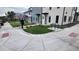 Modern townhome with fresh landscaping, bike rack, and light-colored exterior paint scheme at 1295 Utica St, Denver, CO 80204