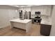 Modern kitchen with large island, stainless steel appliances, and sleek cabinetry at 1295 Utica St, Denver, CO 80204