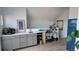 Stylish wet bar area with ample storage, a sink, and a decorative bar cart at 1295 Utica St, Denver, CO 80204