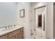 Bright bathroom features a sink and a door leading to the toilet at 19 Red Fox Ln, Littleton, CO 80127