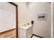 Bathroom featuring a white vanity and modern fixtures, with wood flooring at 19 Red Fox Ln, Littleton, CO 80127