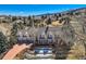 Stately home with a brick facade, a large yard and picturesque mountain views at 19 Red Fox Ln, Littleton, CO 80127