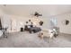 Expansive main bedroom with neutral paint, fan, bench and carpeted floor at 19 Red Fox Ln, Littleton, CO 80127