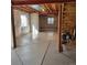 Unfinished basement with poured concrete floor and ample natural light at 13349 Krameria St, Thornton, CO 80602