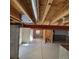 Unfinished basement with exposed ceiling joists and plumbing at 13349 Krameria St, Thornton, CO 80602