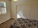 Well-lit bedroom featuring plantation shutters and carpet at 13349 Krameria St, Thornton, CO 80602