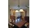 Dining area with dark wood table and light fixtures at 13349 Krameria St, Thornton, CO 80602