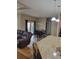 Dining area with dark wood table and chairs near the kitchen at 13349 Krameria St, Thornton, CO 80602