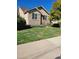 Two-story home with stone and siding exterior, landscaping, and a welcoming front entrance at 13349 Krameria St, Thornton, CO 80602