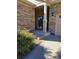 Side view of covered porch with stone and landscaping at 13349 Krameria St, Thornton, CO 80602