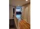 Bright hallway with hardwood floors and staircase to the lower level at 13349 Krameria St, Thornton, CO 80602