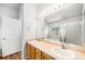 Bathroom featuring double sinks, wood cabinets, and a shower/tub combo at 20558 E Grand Ln, Aurora, CO 80015