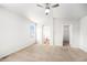 Spacious main bedroom with a ceiling fan, vaulted ceiling, ensuite bath, and walk-in closet at 20558 E Grand Ln, Aurora, CO 80015