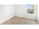 Comfortable bedroom featuring neutral carpet, and a bright window at 20558 E Grand Ln, Aurora, CO 80015