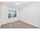Carpeted bedroom with a large window at 20558 E Grand Ln, Aurora, CO 80015