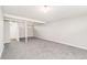 The expansive basement offers neutral paint, carpeted floors, and access to other rooms at 3270 W 92Nd Pl, Westminster, CO 80031