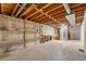 Unfinished basement space featuring exposed ductwork, shelving, and concrete walls at 3270 W 92Nd Pl, Westminster, CO 80031