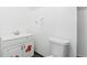 This bright bathroom includes a toilet, vanity, and floral accents at 3270 W 92Nd Pl, Westminster, CO 80031