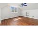 Bright and airy bedroom featuring wood flooring, neutral walls, a ceiling fan, and natural light from the window at 3270 W 92Nd Pl, Westminster, CO 80031