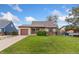 Charming single-story home featuring a well-maintained lawn, attached garage, and beautiful blue sky at 3270 W 92Nd Pl, Westminster, CO 80031