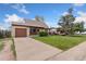 Single-story home showcasing a well-kept front yard, attached garage, and long driveway at 3270 W 92Nd Pl, Westminster, CO 80031